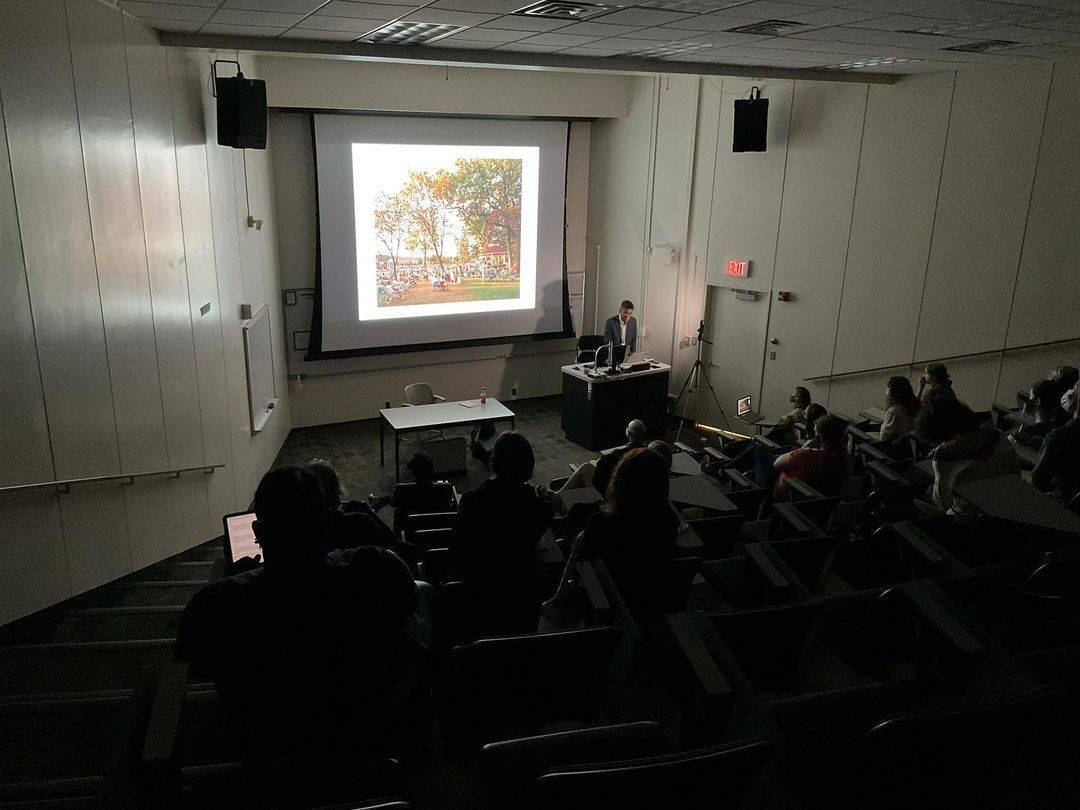 Interior scene of an artist lecture.